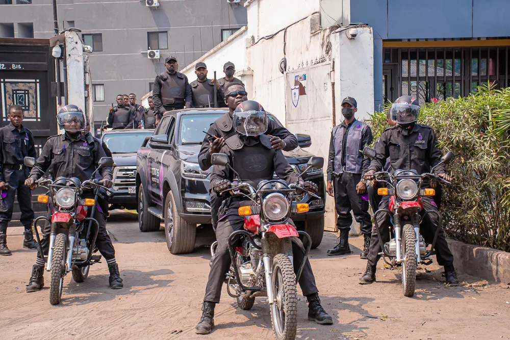 Titans motorcycle officers and vehicle team assembled in a courtyard
