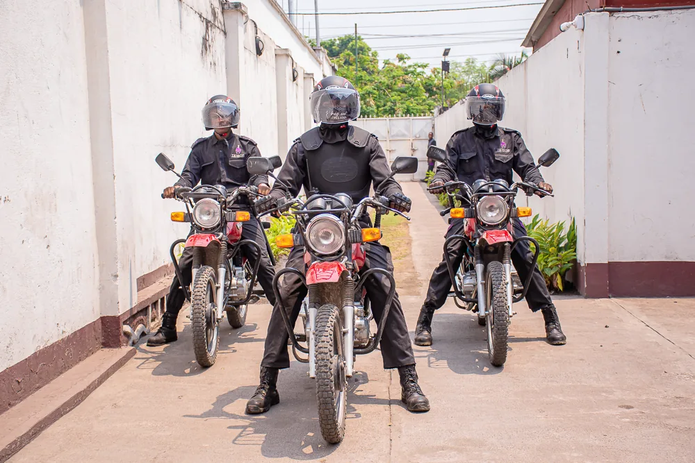 Three Titans motorcycle officers lined up in a courtyard