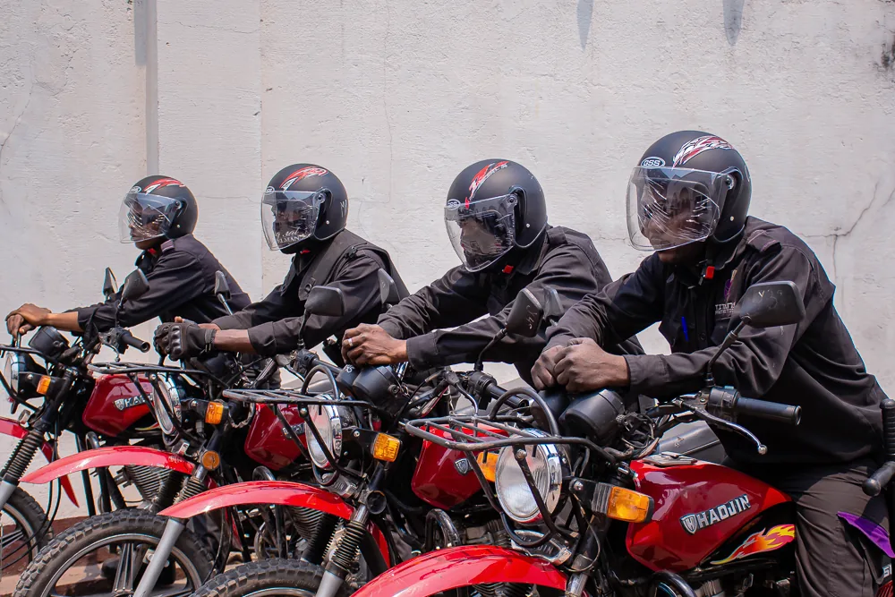 Titans motorcycle patrol officers lined up beside a building